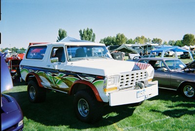1972 Ford Ranchero - Custom painted 1978 Ford Bronco at an outdoor car show.