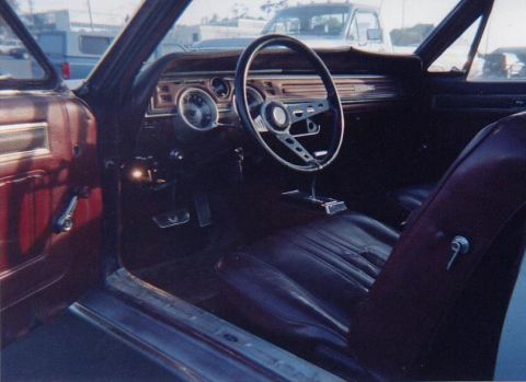1968 Mercury Cougar - The interior of a 1968 Mercury Cougar shows its classic dashboard, steering wheel, and seating.