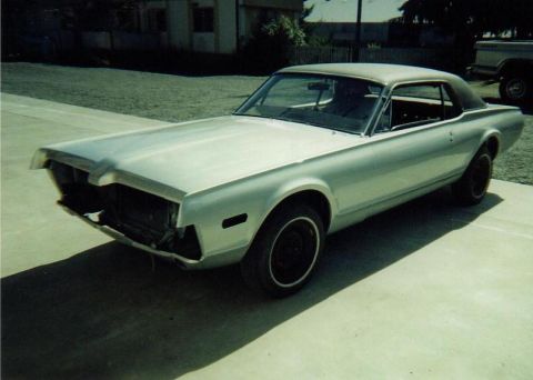 1968 Mercury Cougar - A silver 1967 Mercury Cougar is shown with its front grille and bumper removed.