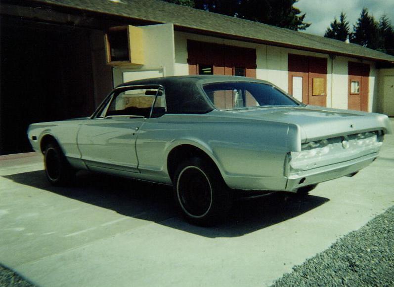 Silver 1968 Mercury Cougar coupe, rear view, black vinyl top