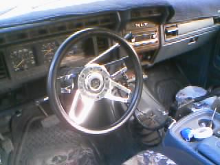 1986 Ford Bronco - Interior view of a 1986 Ford Bronco, showing the dashboard, steering wheel, and center console.
