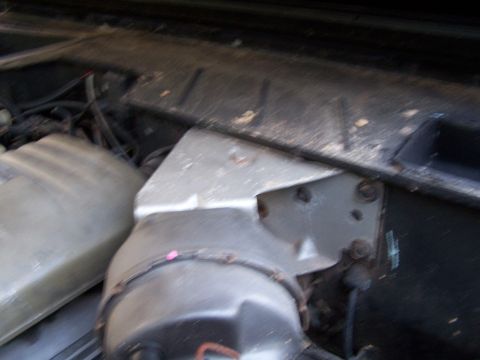 1979 Ford F-150 - Close-up view of engine bay components, including a brake booster and fluid reservoir.