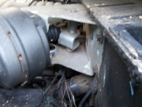 1979 Ford F-150 - Close-up view of a brake booster and associated components on a vehicle's firewall.