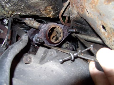 1990 Lincoln Town Car - New studs back into the manifolds. The calipers told us that the passenger manifold side stud centers are considerably wider than the drive…