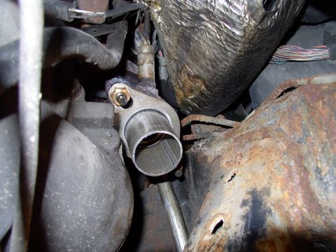 1990 Lincoln Town Car - First he cut off the last 4" of the flared pipe, the part which is expanded to accept a 2" pipe. His reasoning was we could slip the 2 1/4"…