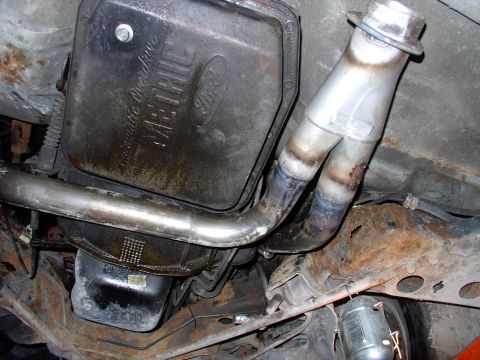 1990 Lincoln Town Car - The driver's side headpipe makes another 90 degree towards the rear, completely clearing the transmission pan. The passenger's headpipe run…