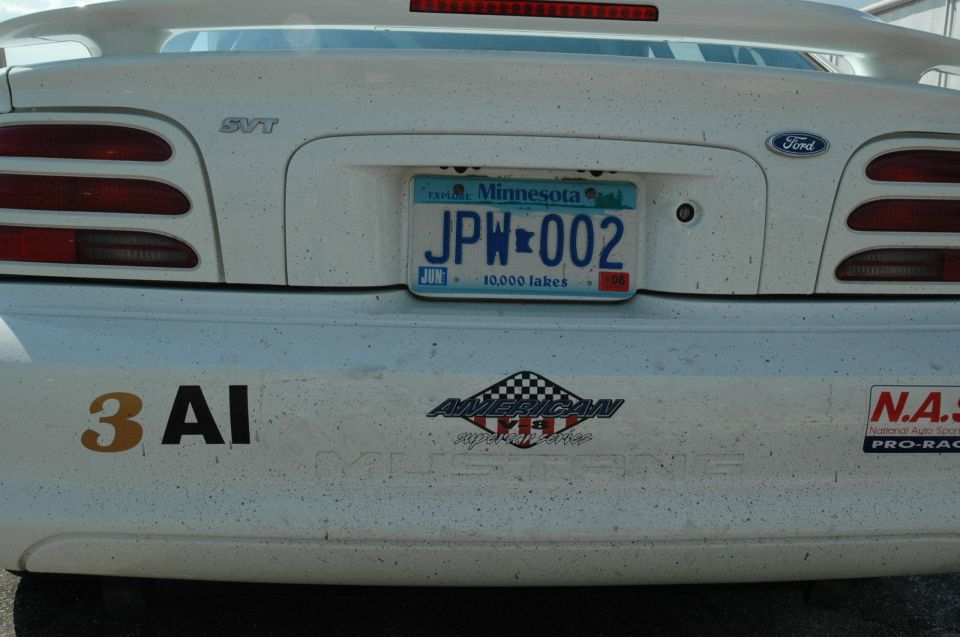 White Ford Mustang SVT rear bumper with license plate JPN-002 and racing stickers