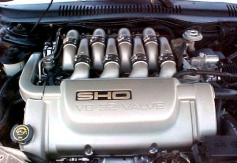 1997 Ford Expedition - Close-up of an engine bay, showing the SHO V8 32 Valve cover and intake manifold.