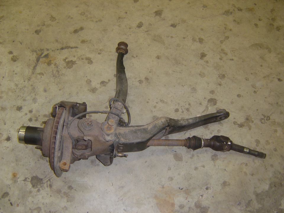 Front suspension assembly with disc brake rotor and CV axle