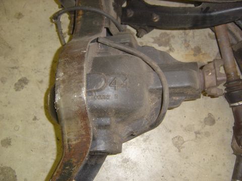 1993 Ford Bronco - A D44 axle housing is shown, with casting numbers visible on the metal casing.