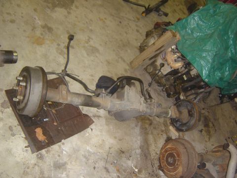 1993 Ford Bronco - A rear axle assembly with drum brakes is shown, likely for an older vehicle.