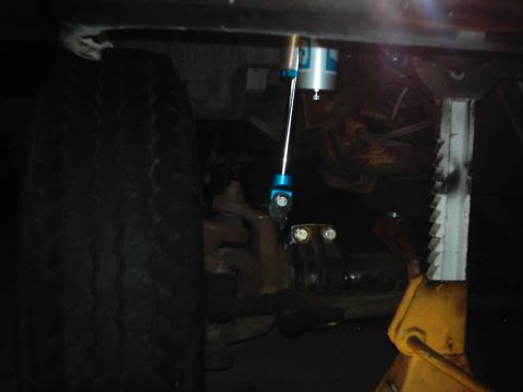 1978 Ford Bronco - Undercarriage view shows a modified shock absorber assembly, with a Supermotors.net watermark.