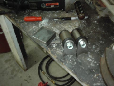 1978 Ford Bronco - Various automotive parts and tools are laid out on a workbench, ready for a project.
