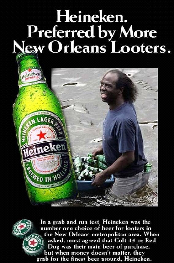 Man in water with beer bottles and a large Heineken bottle