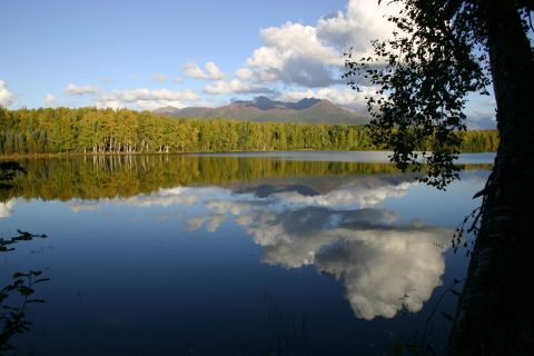 2003 Jeep TJ - Scenic view of a lake in Alaska with autumn foliage and mountain backdrop.