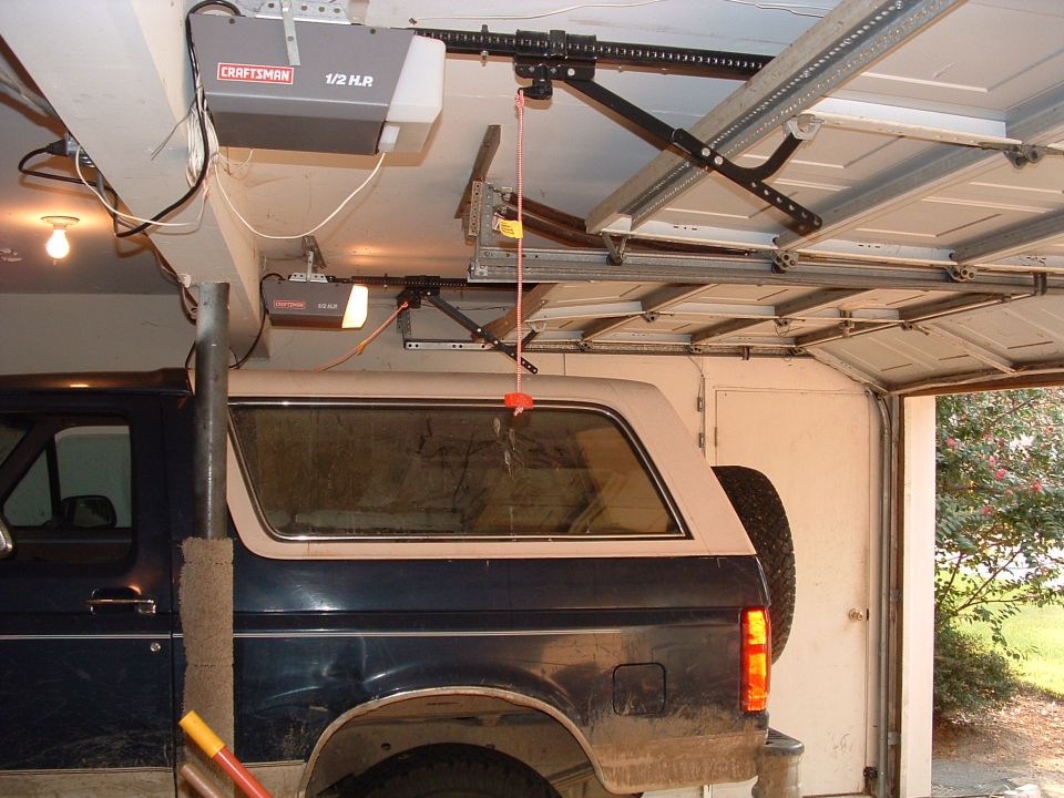 1993 Ford Bronco side view, dark blue and tan