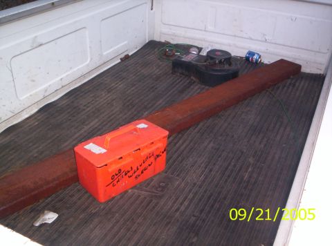 1985 Ford Bronco - Contents of a truck bed, including tools and lumber, photographed on September 21, 2005.