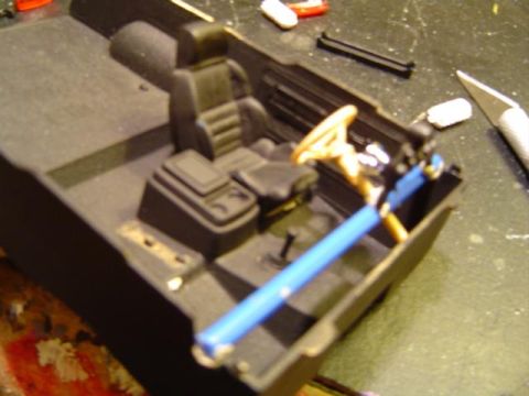 1979 Ford Bronco - This is a close-up view of a model car's interior, showing the seats, dashboard, and steering wheel assembly.