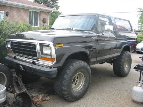 1985 Ford Bronco - This Ford Bronco features a lifted suspension and oversized off-road tires.