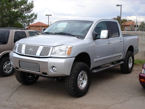 2005 Nissan Titan - New 2006 Titan 4x4 with 6" lift and 35x12.5R17. Looks like an LE, but has factory looking "no fear" logos??? Has 2 week old paper tags on i…