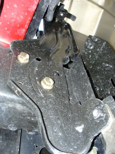 2005 Nissan Titan - Detail of a metal bracket and bolts, likely related to a bumper modification.