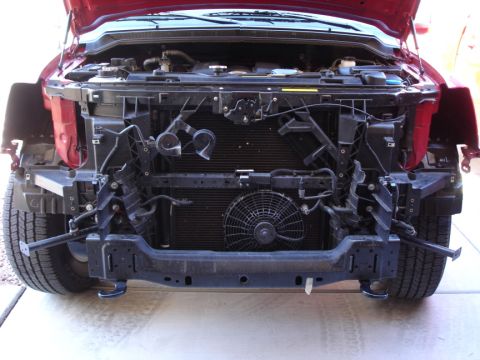 2005 Nissan Titan - Front end of a 2005 Nissan Titan with the bumper removed for access to the radiator and fan.