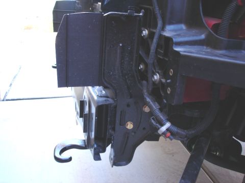 2005 Nissan Titan - Close-up view of a vehicle's frame and mounting bracket, showing wiring harness details.