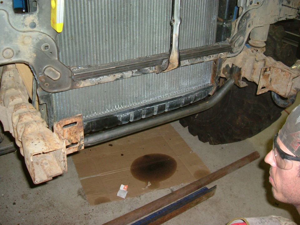 Front frame and radiator of a truck, showing rust and some modifications