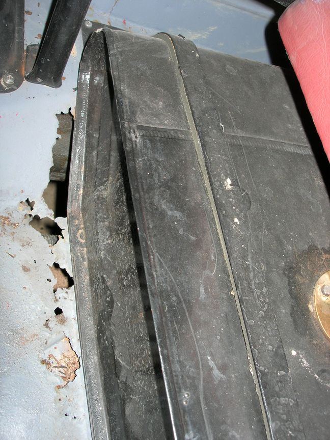 Rusted metal and black component in vehicle interior