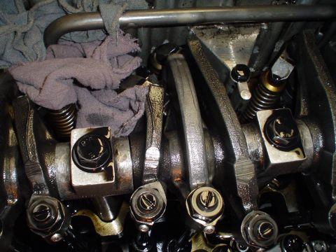 1966 International School Bus - This image shows the internal components of an engine's valve train, including rocker arms and springs.
