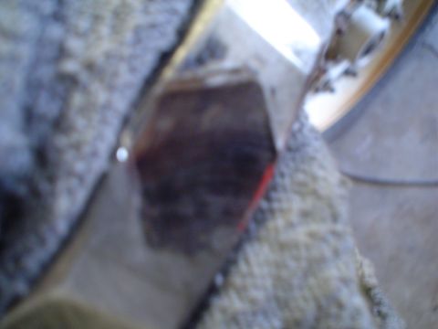 1966 International School Bus - Close-up of a vehicle's interior, partially obscured by a fuzzy blanket, with a visible portion of the dashboard.