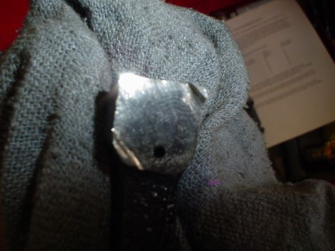 1966 International School Bus - A small metal component is shown, partially obscured by a textured fabric material.