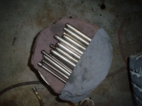 1966 International School Bus - A collection of valve lifters are laid out on a rag, likely for engine repair or maintenance.