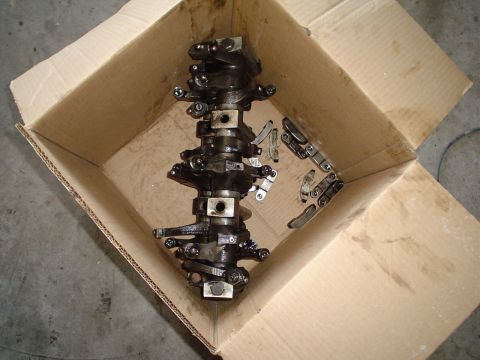1966 International School Bus - Engine camshaft and associated lifters are shown inside a cardboard box.