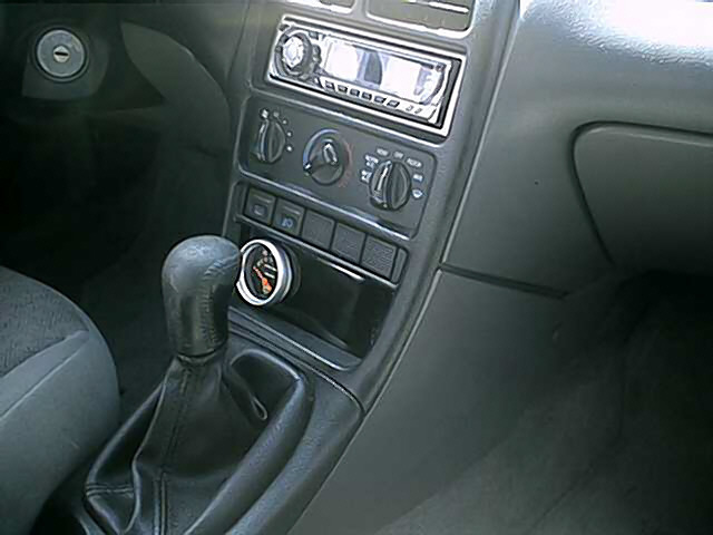 Interior view with aftermarket gauge and shifter