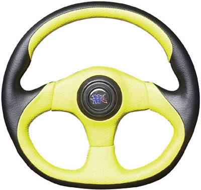 1985 Ford Bronco - A close-up view of a custom steering wheel with a two-tone color scheme and a central emblem.