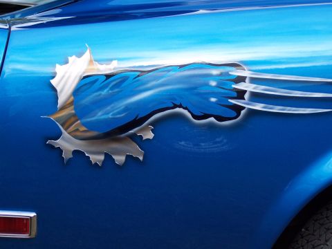 1972 Ford Ranchero - Airbrushed graphic on a blue car depicts claws ripping through the metal.