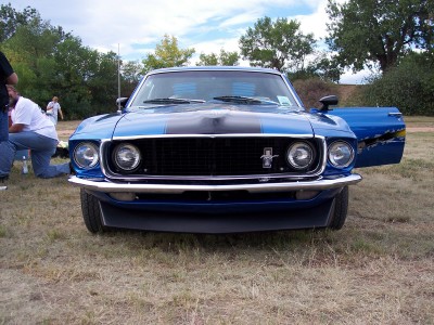 1972 Ford Ranchero - Front view of a blue 1970 Ford Mustang Mach 1 with a black stripe down the hood and roof.