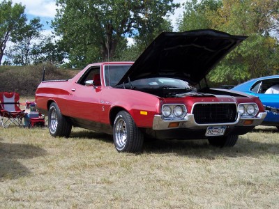 1972 Ford Ranchero - A red 1972 Ford Ranchero is displayed with its hood open at an outdoor event.