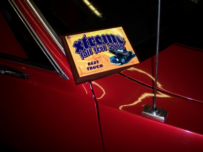 1972 Ford Ranchero - A trophy sits on the fender of a red vehicle at the Xtreme Fall Fest 2005.