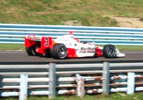 1979 Ford F-150 - An open-wheel race car with Marlboro branding and the number 3 is seen on a track.