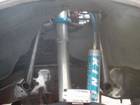 1978 Ford Bronco - Close-up view of off-road suspension components, prominent KING branding on a shock absorber.