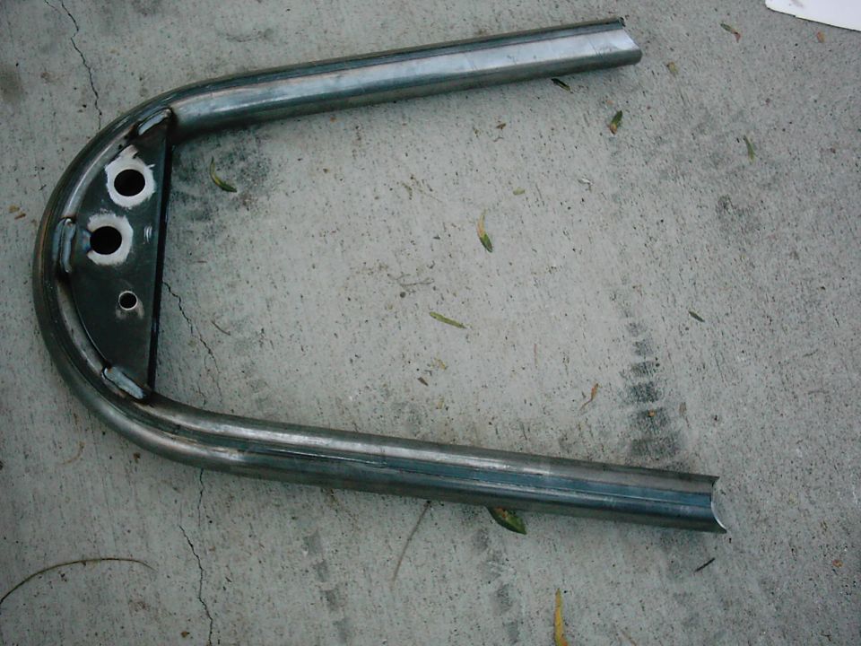 Metal hoop with mounting holes, likely for a custom motorcycle seat