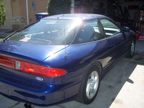 1995 Ford Probe - Rear view of a blue 1995 Ford Probe parked in a driveway.