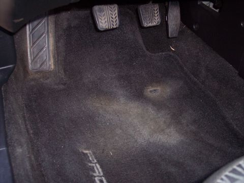 1995 Ford Probe - Interior view of car floor mats and pedals, with 'PROBE' text visible on the carpet.
