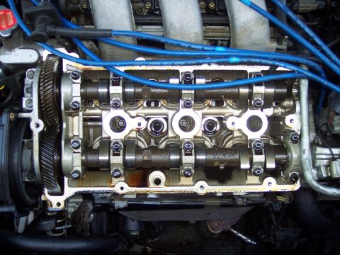 1995 Ford Probe - Close-up view of an engine's internal components after the valve cover has been removed.