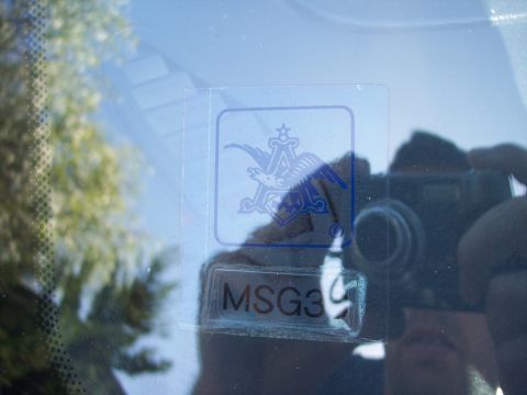 1995 Ford Probe - A close-up view of a sticker on a vehicle's windshield, the Budweiser logo and the text 'MSG39'.