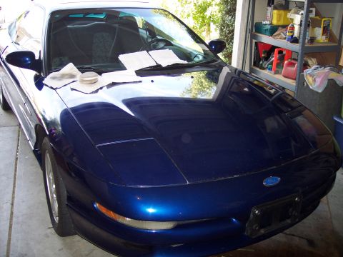 1995 Ford Probe - Front view of a blue 1995 Ford Probe, appearing to be prepped for detailing.