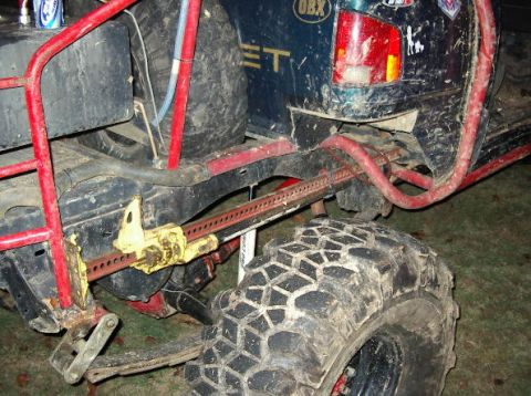 1985 Ford Bronco - Off-road vehicle rear axle assembly with a hi-lift jack mounted to the frame.