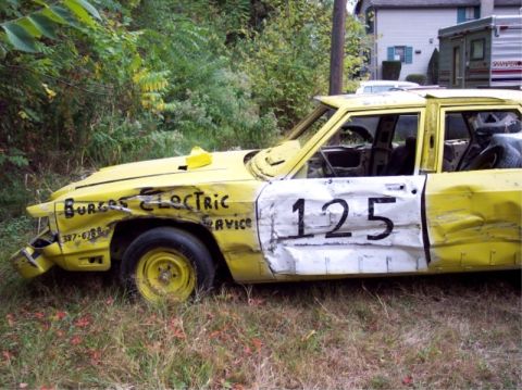1987 Mercury Grand Marquis - This heavily damaged 1987 Mercury Grand Marquis shows signs of demo derby use with its number 125 painted on the side.